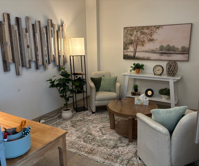 Counseling room with armchairs, plants and soft lighting at the Hope and Wholeness Newaygo office